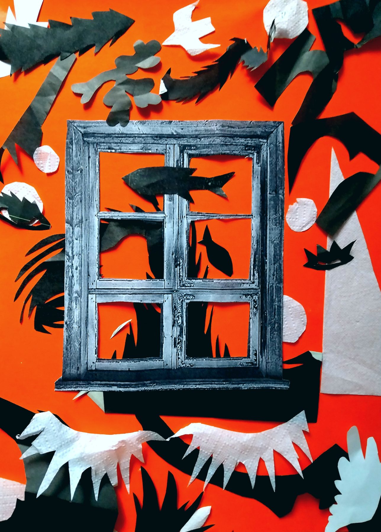 An orange-red ground. A grey window frame of six panes stands at the centre; black paper fish swim through and behind the glass. Black cut conifers and oak leaves crowd the top, a torn napkin form runs along the bottom edge, and pale embossed circles float at the right.